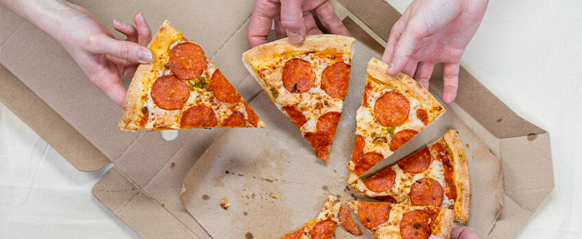people eating pizza on national pi day