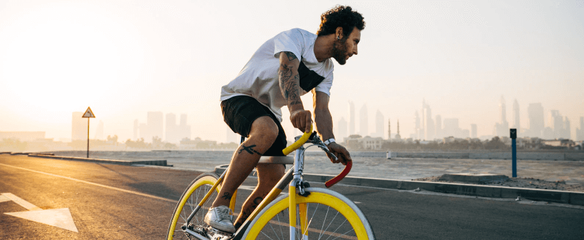 man on bike going to store for labor day sales