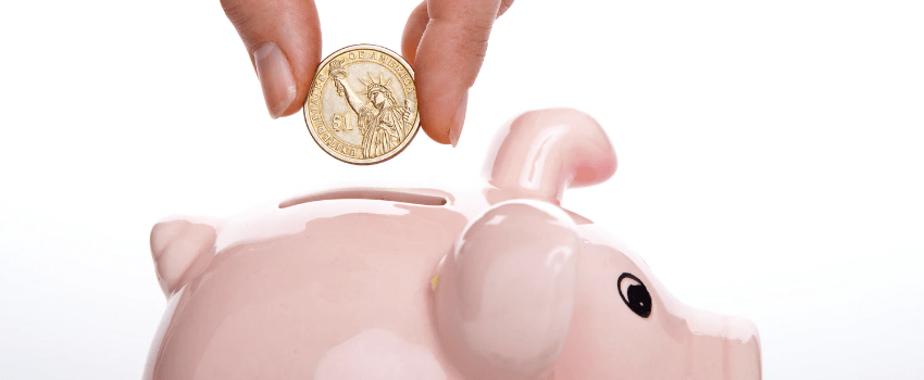 student saving money in a piggy bank