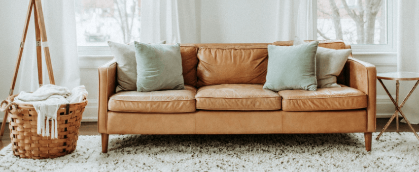 modern sofa with mint green pillows