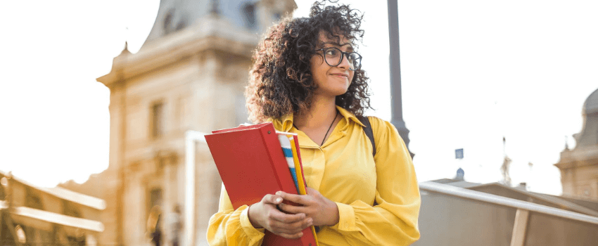 student girl holding books