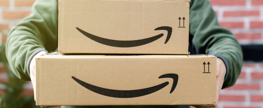 person holding amazon packages