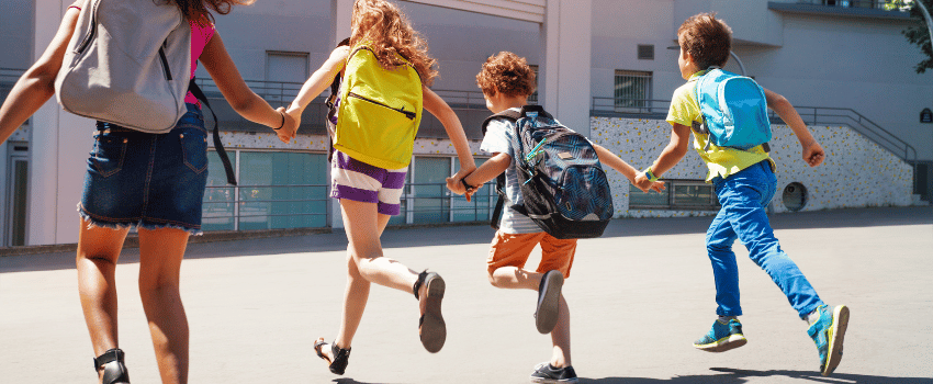 happy kids running holding hands